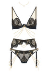 Edge o’ Beyond’s Kathryn Brief Designed with dramatic cut outs, black satin bound edges and a fishnet style scalloped lace.  Shown as full women's underwear set with 18k gold plated chains