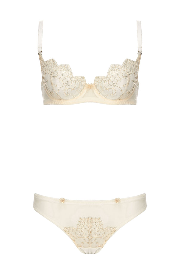 Edge o’ Beyond Evie lingerie brief created from ivory sheer tulle and intricate gold gilted lace. A playful rear peep makes this unique women’s underwear. Pair with a babydoll or negligee for perfect bridal look. Shown with Evie Buttercream bra