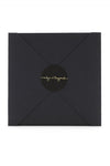 The delicate gold chains of Michael and Samuel come in their own special black and gold envelopes
