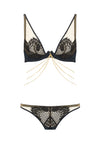 Designed with dramatic cut outs, satin bound edges and a fishnet style scalloped lace, the Kathryn thong plays with positive and negative space to create high drama lingerie shown with bra and 18k gold plated chains